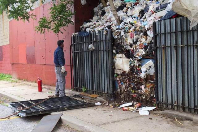 This undated photo shows a six-ton trash pile in Brownsville that accumulated over the course of 30 years before its removal in 2014.